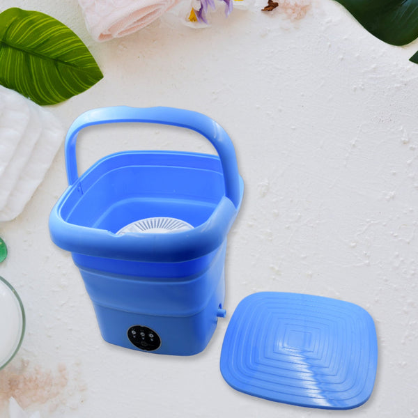 Foldable mini washing machine with drain basket, suitable for laundry and travel.