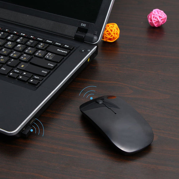 Wireless mouse for laptop, PC, Mac, and iPad, sleek design.