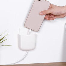 Phone holder with charging port.