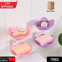 Self-draining soap dish with flower design, suitable for bathroom or kitchen.