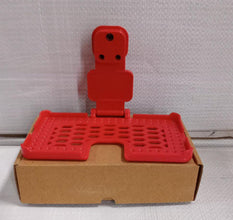 Multi-purpose wall holder in red.