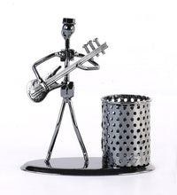 Showpiece of musician playing bass guitar, iron pen stand.